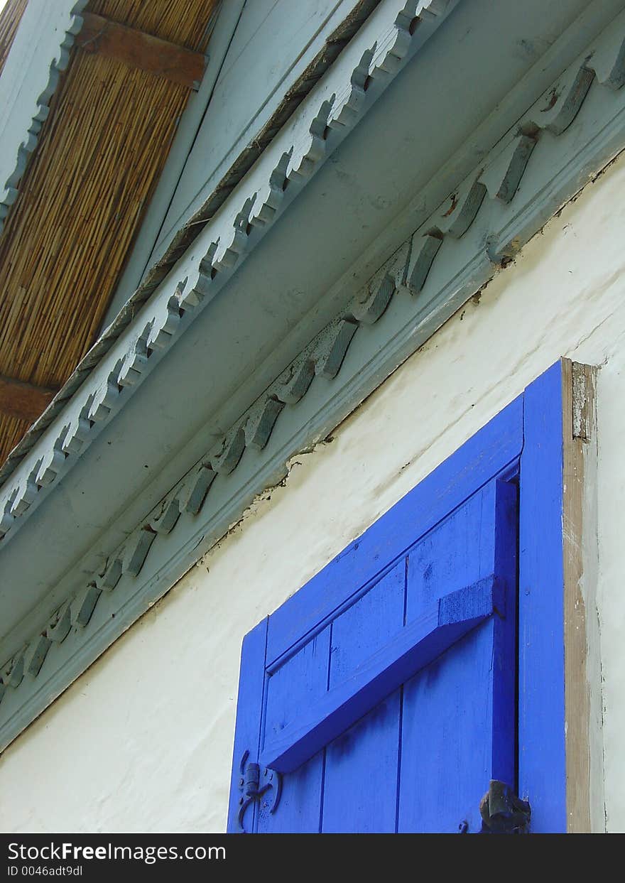 House with blue window