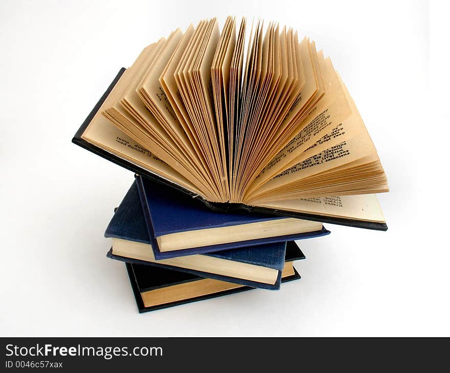 Four old books on white background