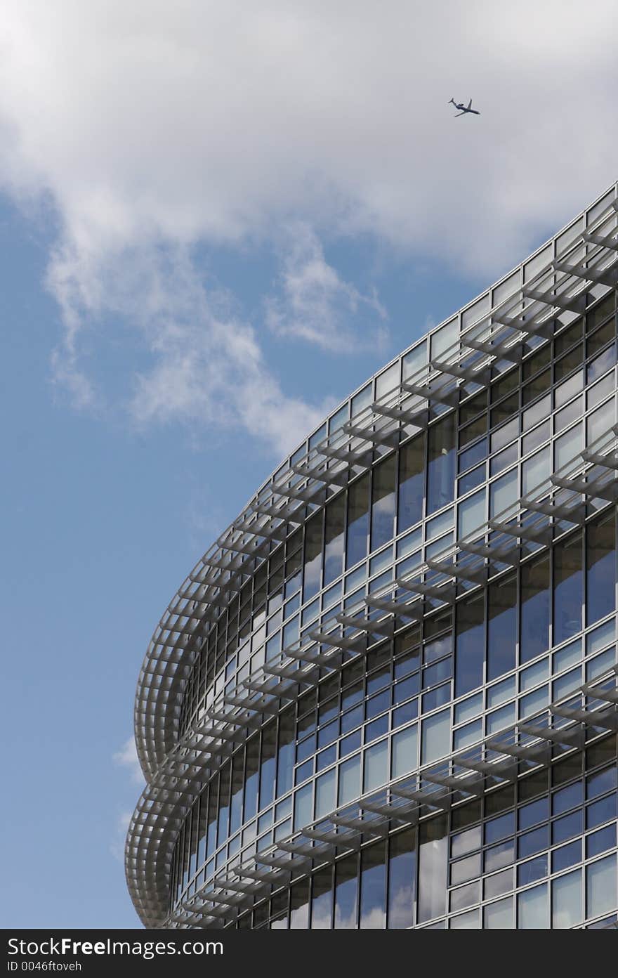 Modern Building detail with Jet Airplane in the sky. Modern Building detail with Jet Airplane in the sky