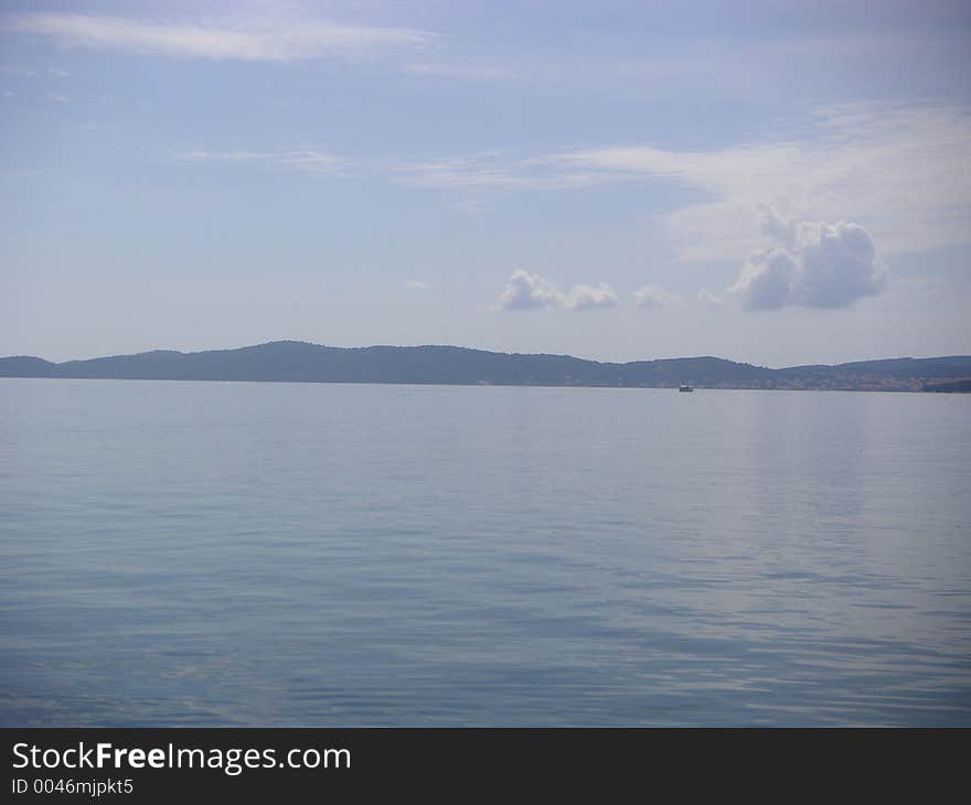 Adriatic sea view from the Croatian coast near Zadar towards the insland of Pasman. Adriatic sea view from the Croatian coast near Zadar towards the insland of Pasman.