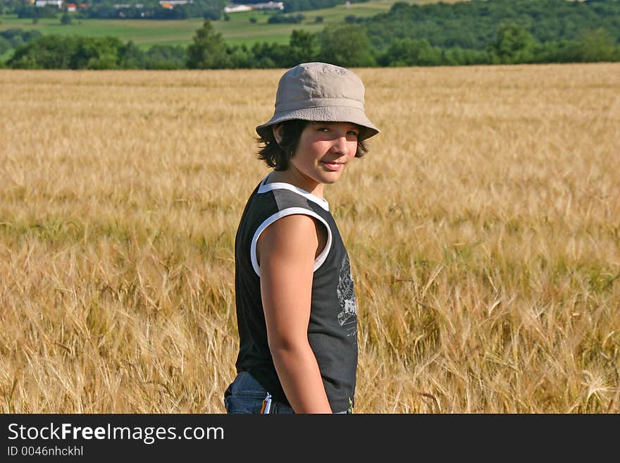 Young boy in a Barley field