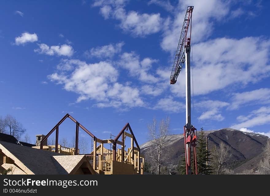 Small construction in the mountains with crane. Small construction in the mountains with crane