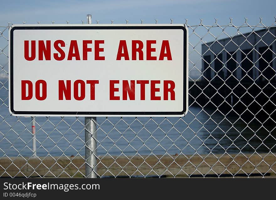 Sign on fence. Sign on fence.