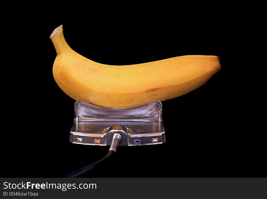 Image of a banana being 'charged' - conceptual energy. Image of a banana being 'charged' - conceptual energy