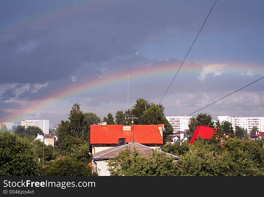 Rainbow after the rain in city