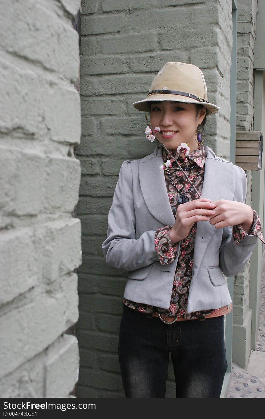 Korean girl holding a cherry blossom. Korean girl holding a cherry blossom