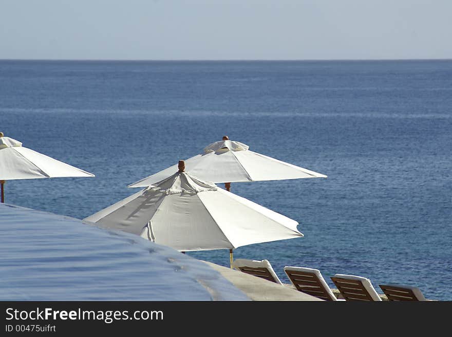 Poolside view overlooking ocean. Poolside view overlooking ocean