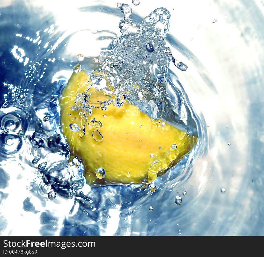 Lemon splashing water. Lemon splashing water