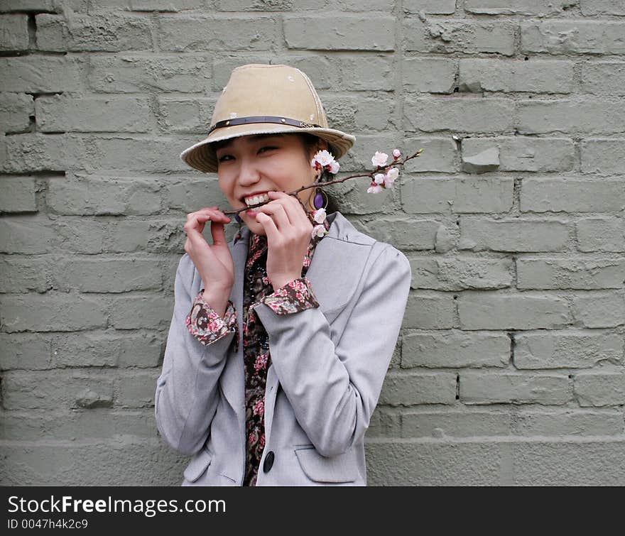 Korean woman with cherry blossom in her mouth. Korean woman with cherry blossom in her mouth