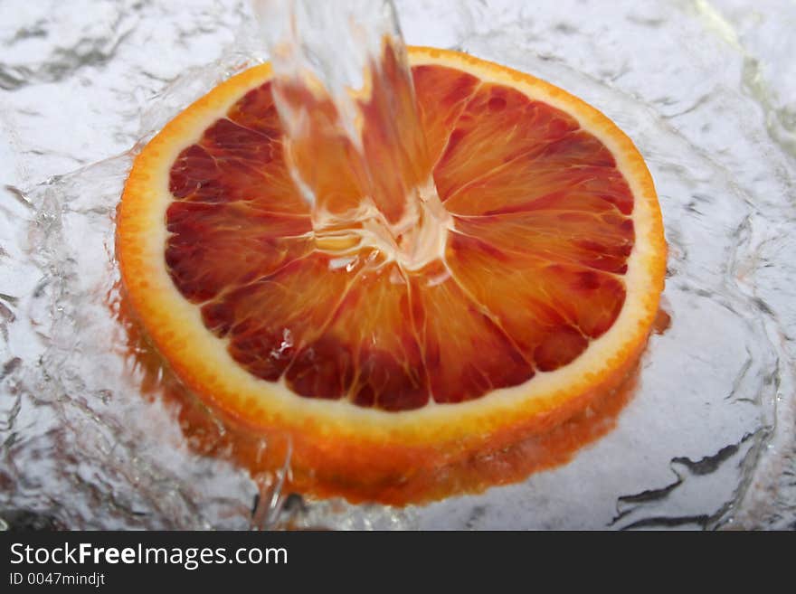 Orange slice in water