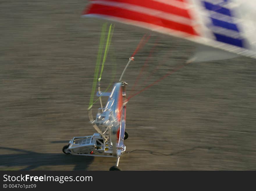 Close-up of a model paraglider landing at high speed. Close-up of a model paraglider landing at high speed.