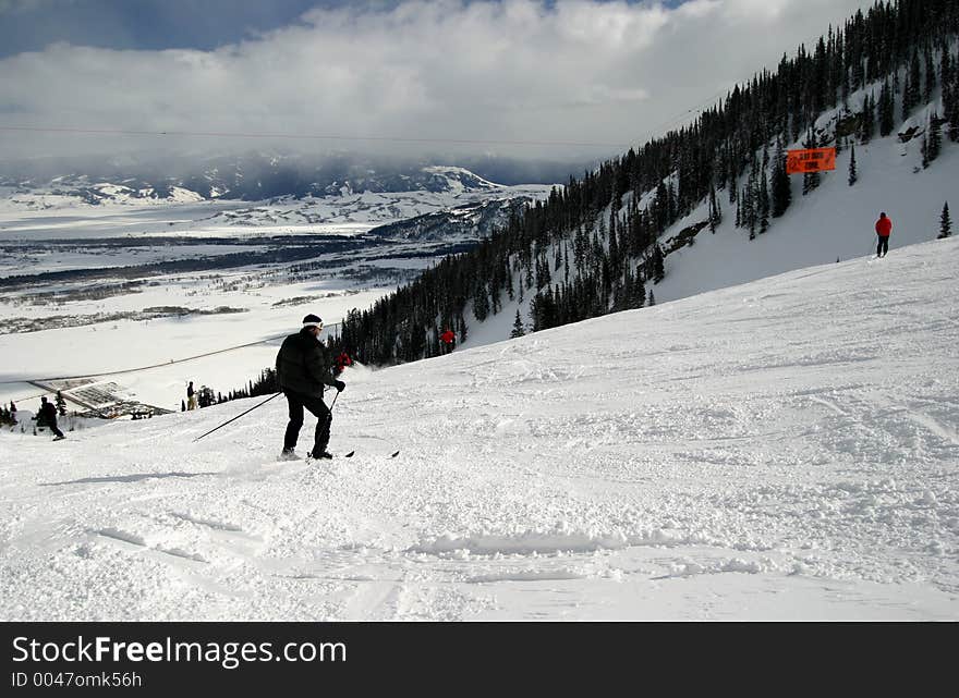 Skiing on a ski slope with various skiers about the Winter scene. Skiing on a ski slope with various skiers about the Winter scene.