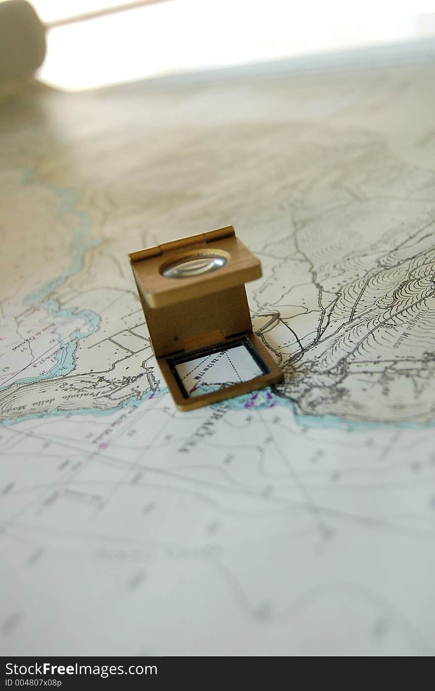 A magnifer lens on map