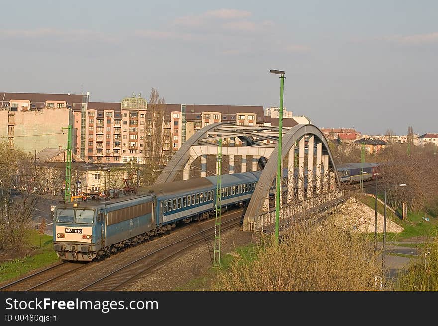 In 2006, this train is hauled by a different locomotive than in 2005. The photo was taken in Budapest between Keleti and Kelenfold stations, some minutes before sunset. In 2006, this train is hauled by a different locomotive than in 2005. The photo was taken in Budapest between Keleti and Kelenfold stations, some minutes before sunset.