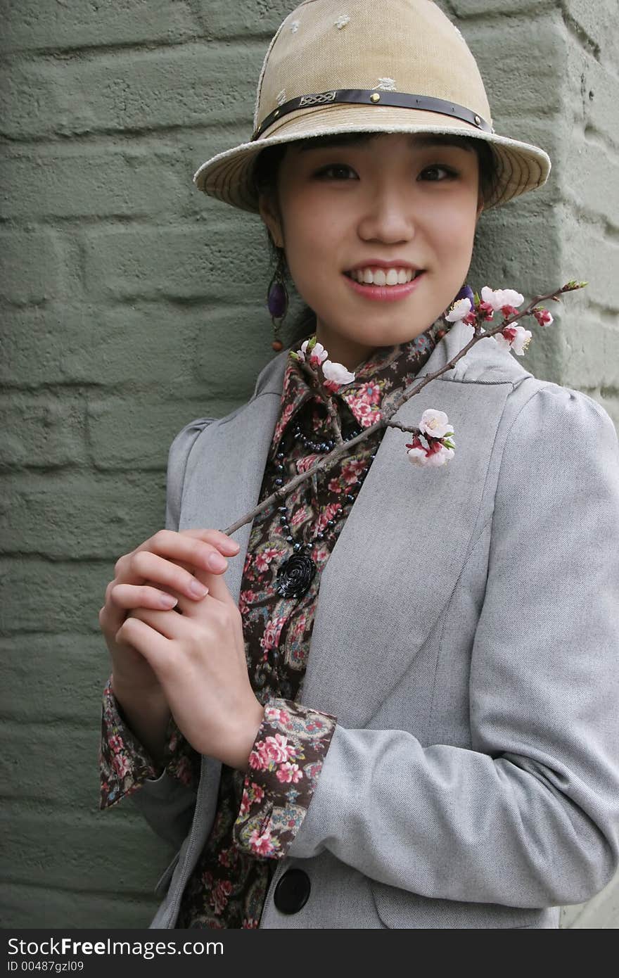 Beautiful Korean girl holding spring flowers. Beautiful Korean girl holding spring flowers