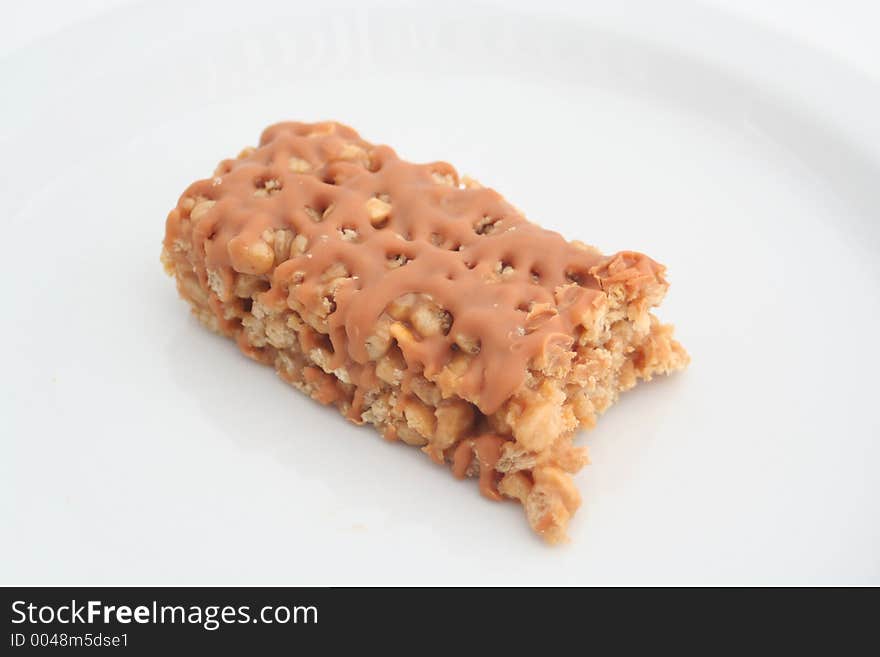 Half eaten snack bar on a white background