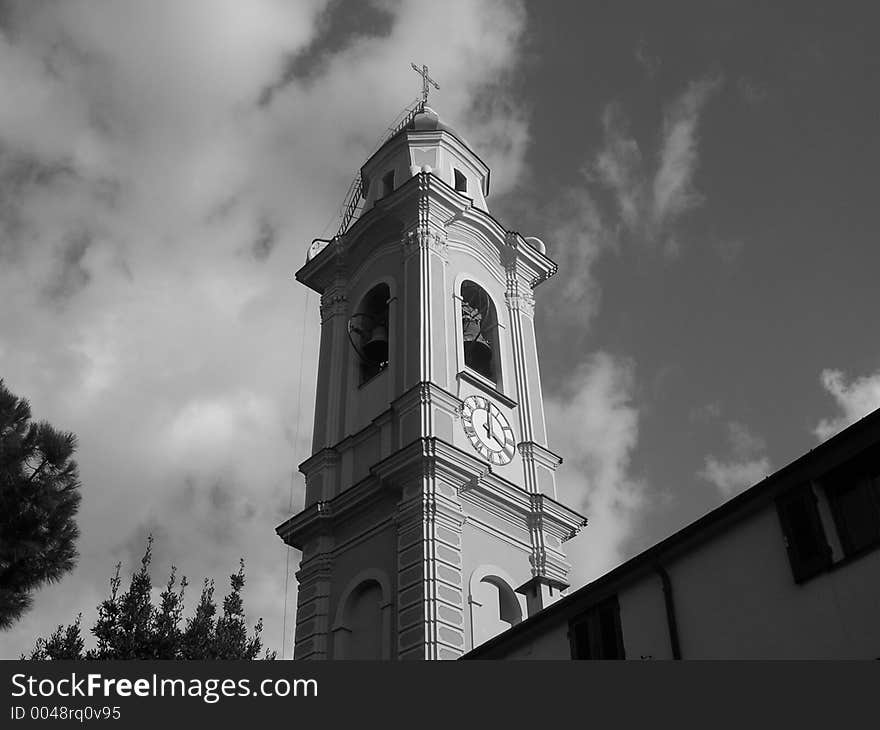 Clock Tower of a catholic church in a cloudy day. Clock Tower of a catholic church in a cloudy day