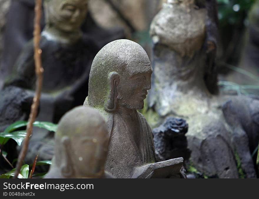 Stone statue at the japanese cemetery