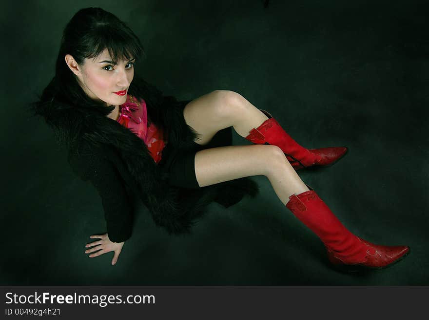 Young woman in red cowboy boots, shot from above. Young woman in red cowboy boots, shot from above