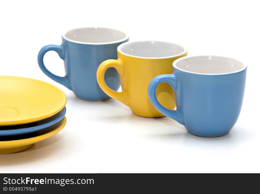 Coffee cups and dishes on white background. Coffee cups and dishes on white background