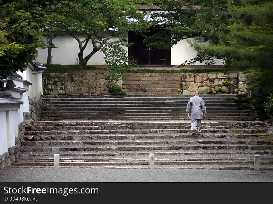 Monk at the temple entrance. Monk at the temple entrance