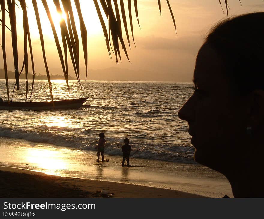 Young woman looking at the sunset. Young woman looking at the sunset