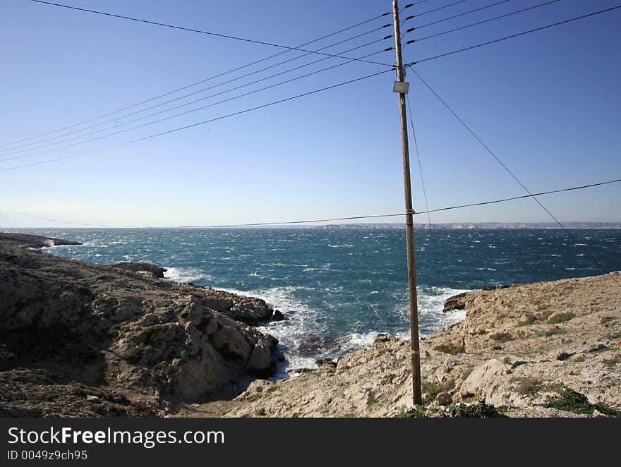 Telegraph poles on the shore-line at les goudes, marseille, france. Telegraph poles on the shore-line at les goudes, marseille, france