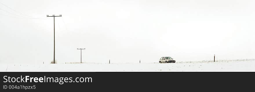 White car in White Snow Landscape. White car in White Snow Landscape