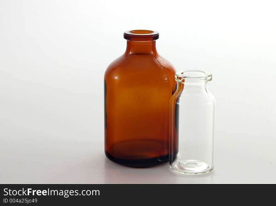 Amber and clear glass bottles. Amber and clear glass bottles.