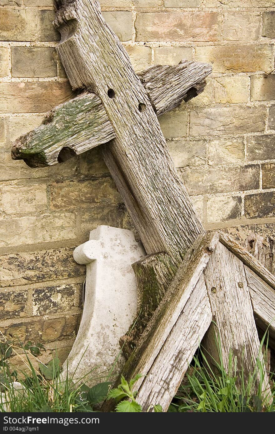 Wooden cross head stone.