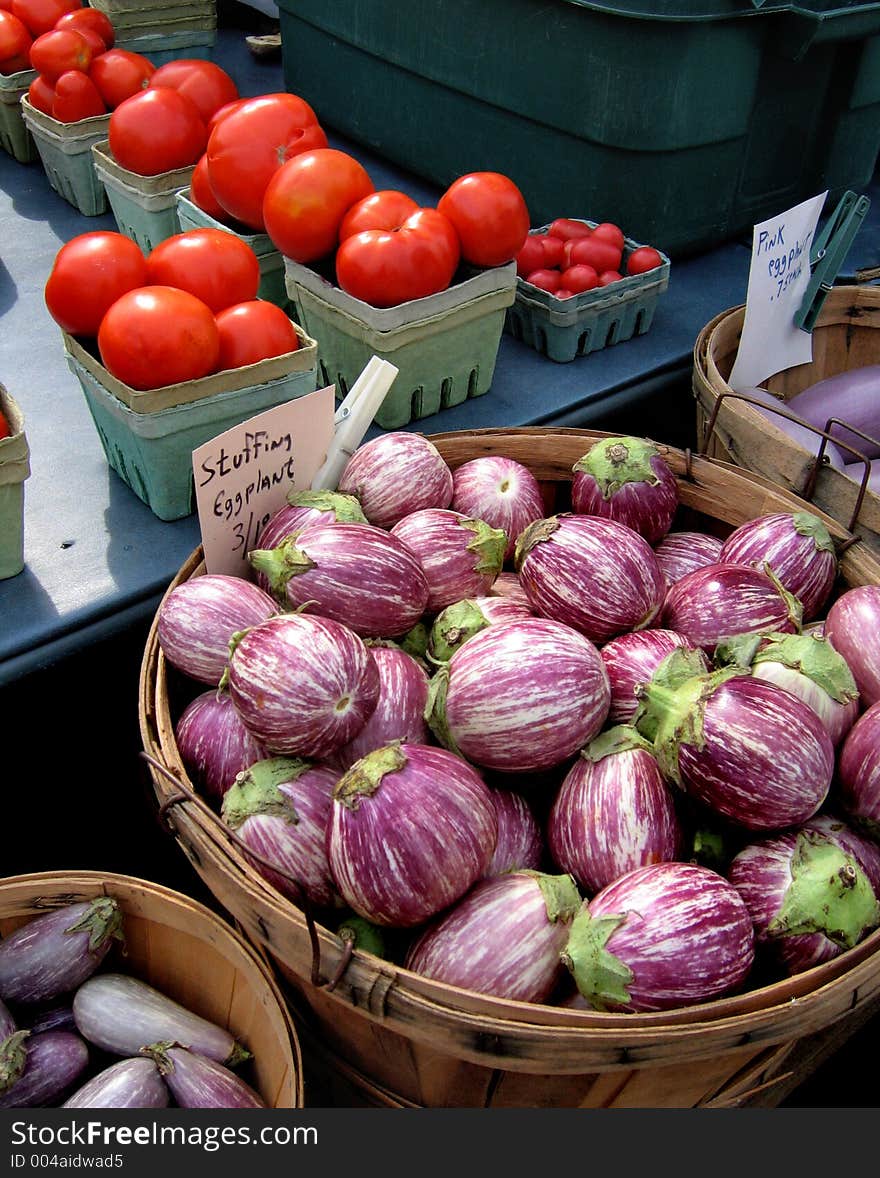 Basket of eggplants and tomato's. Basket of eggplants and tomato's