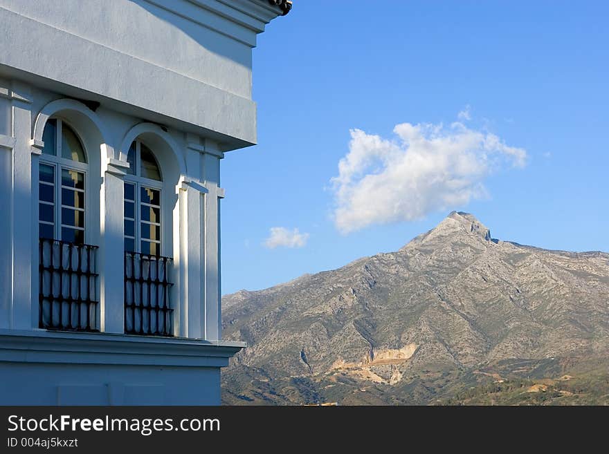 Building and mountain views of Aloha Pueblo in Spain