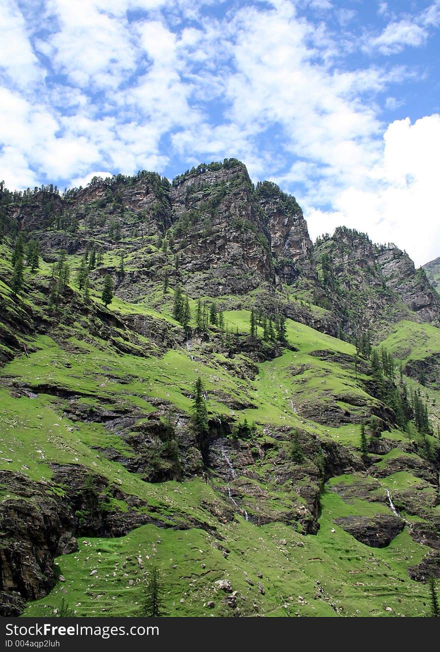 Slopes, cliffs, blue skies and greens mountains. Slopes, cliffs, blue skies and greens mountains