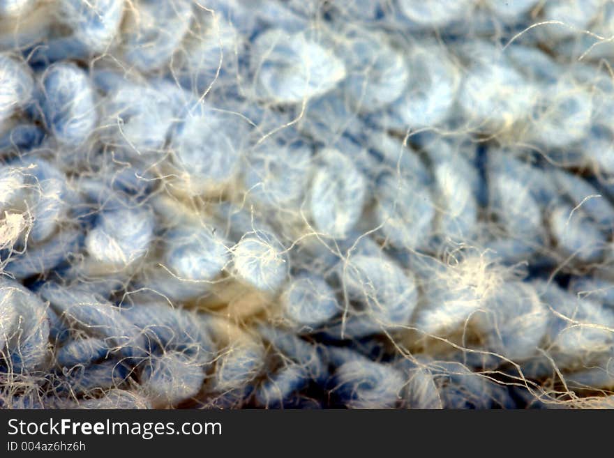 Piece of textile magnified three times. Piece of textile magnified three times