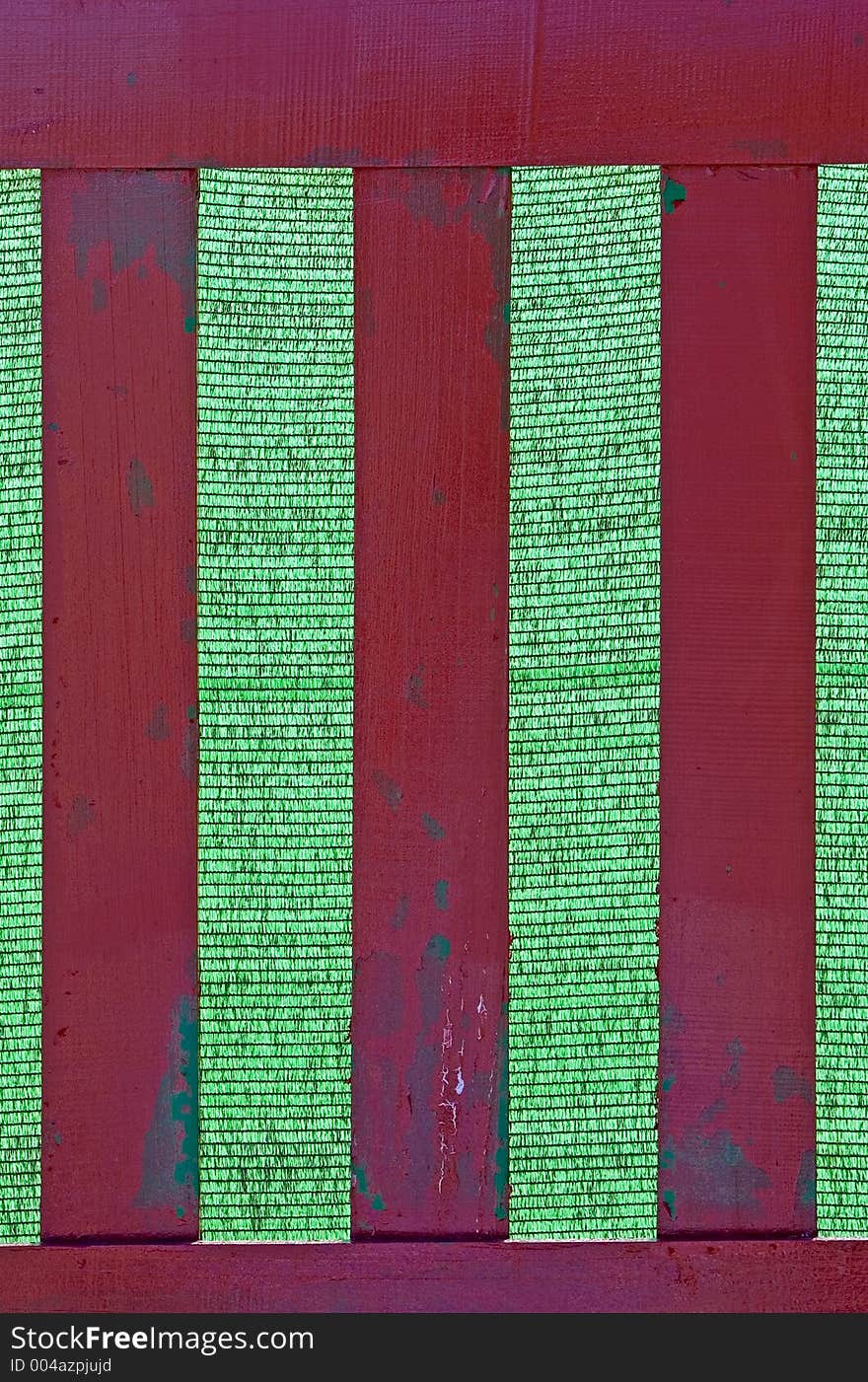 Wooden fence with green background