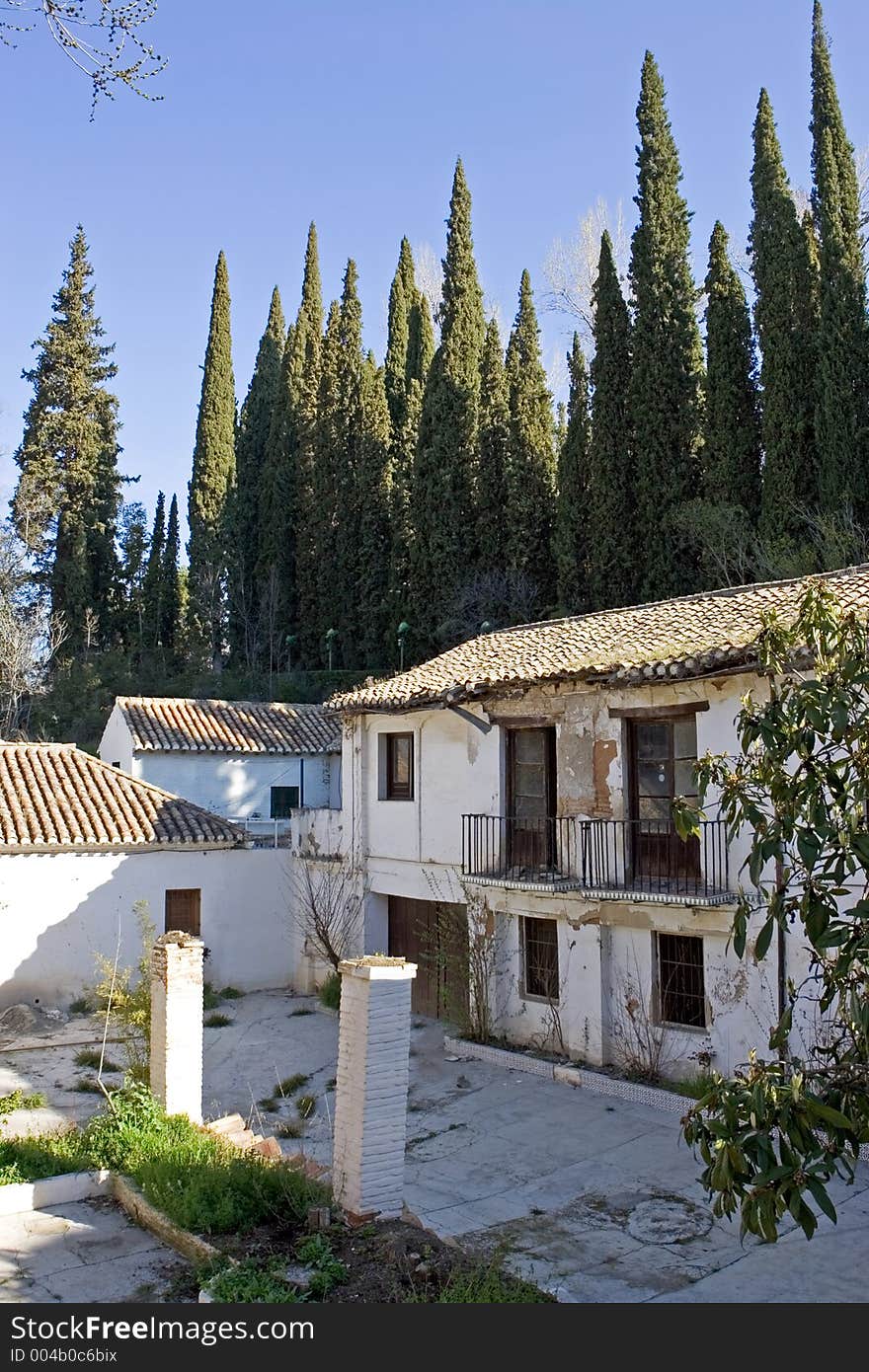 Ruins on the exterior of the ancient Alhambra Palace in Granada on the Costa del Sol in Spain. Ruins on the exterior of the ancient Alhambra Palace in Granada on the Costa del Sol in Spain