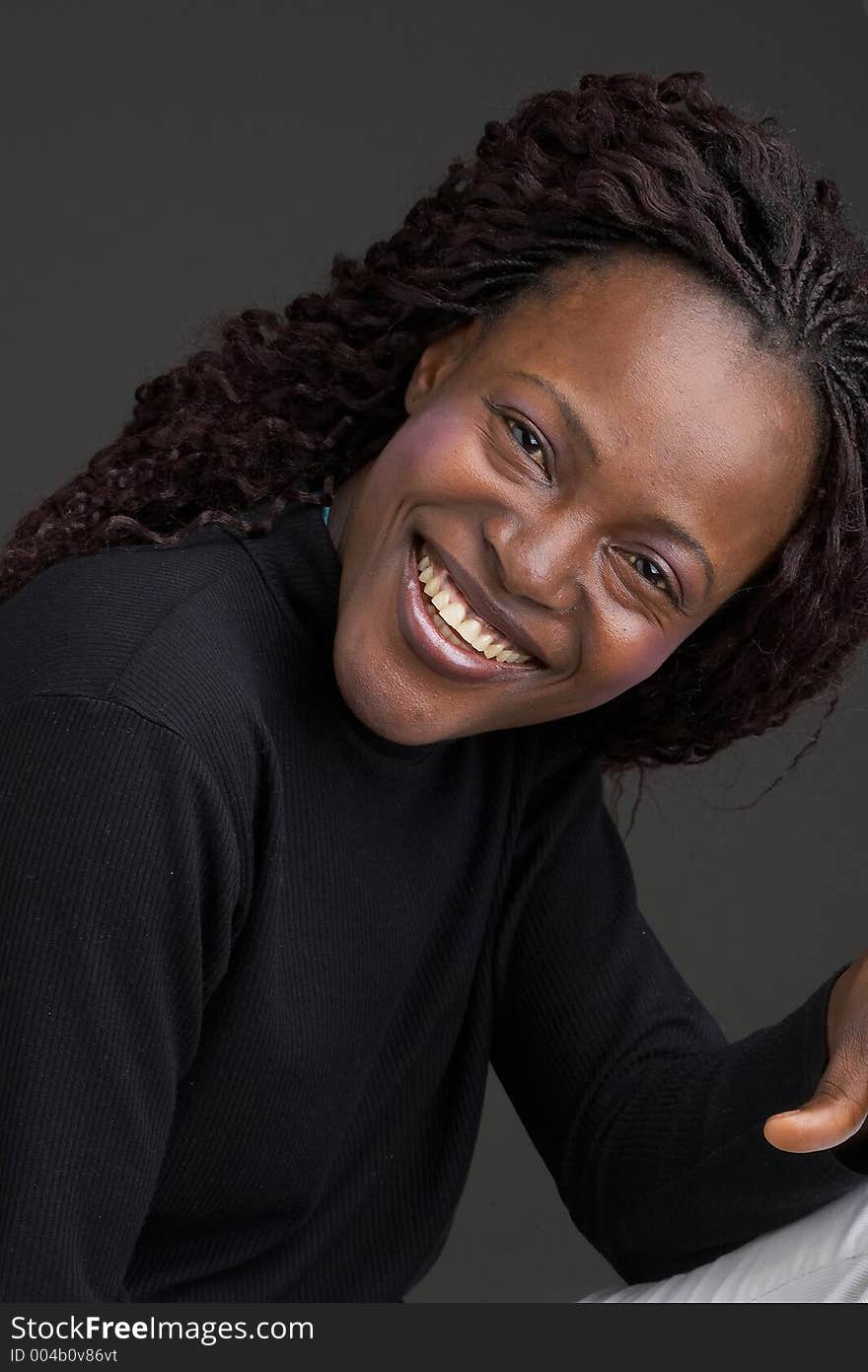 Smiling black girl with dark background