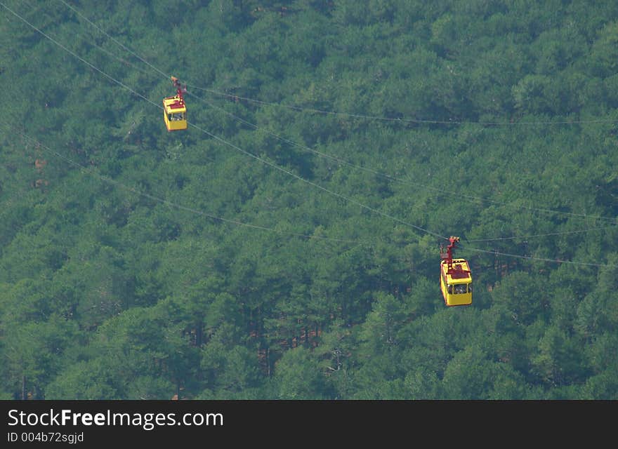 Cable car above a wood, crimea, mountain ajpetri