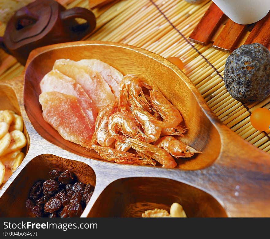 Shrimps and ham in a special design bowl together with other food assortment. Shrimps and ham in a special design bowl together with other food assortment.