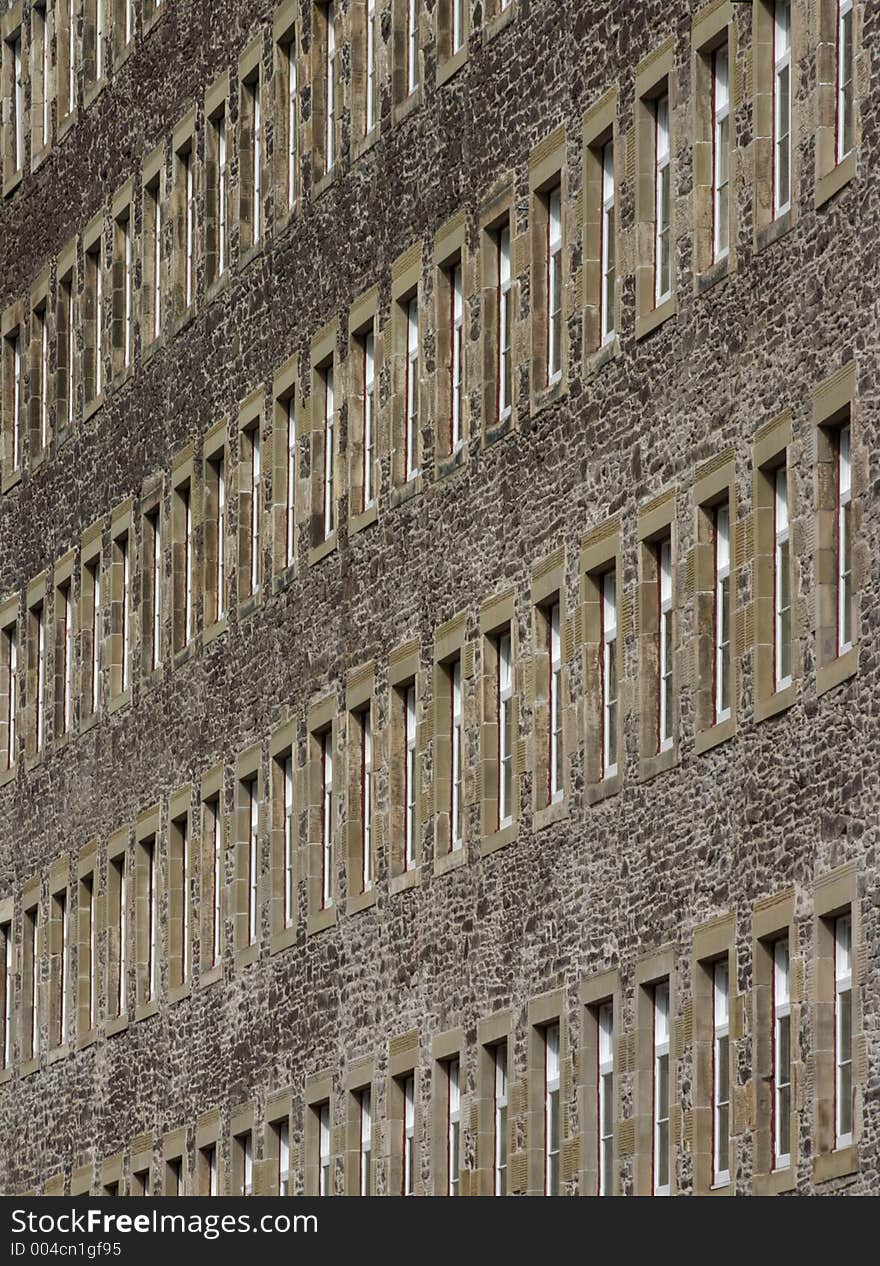 Rows of old windows in a mill in New Lanark. Rows of old windows in a mill in New Lanark.