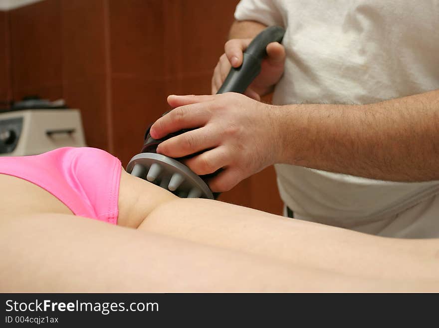 Anticellulite massage with specific equipment in a spa complex. Anticellulite massage with specific equipment in a spa complex