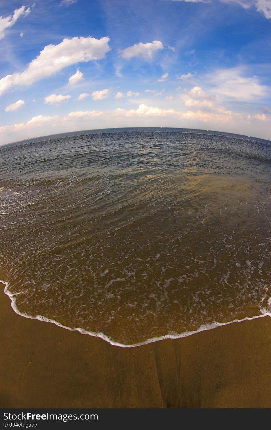 Sea, sky and beach fisheye image