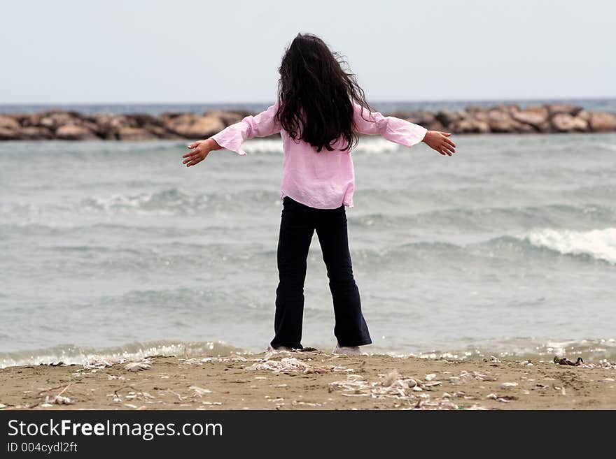 Young girl by the beach. Young girl by the beach