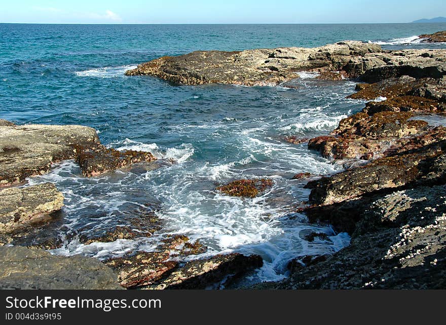 Surging water on the rocks. Surging water on the rocks