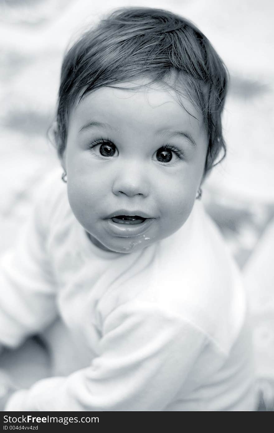 close-up of a child after having dinner. Visible food around mouth. Black and white image. close-up of a child after having dinner. Visible food around mouth. Black and white image.