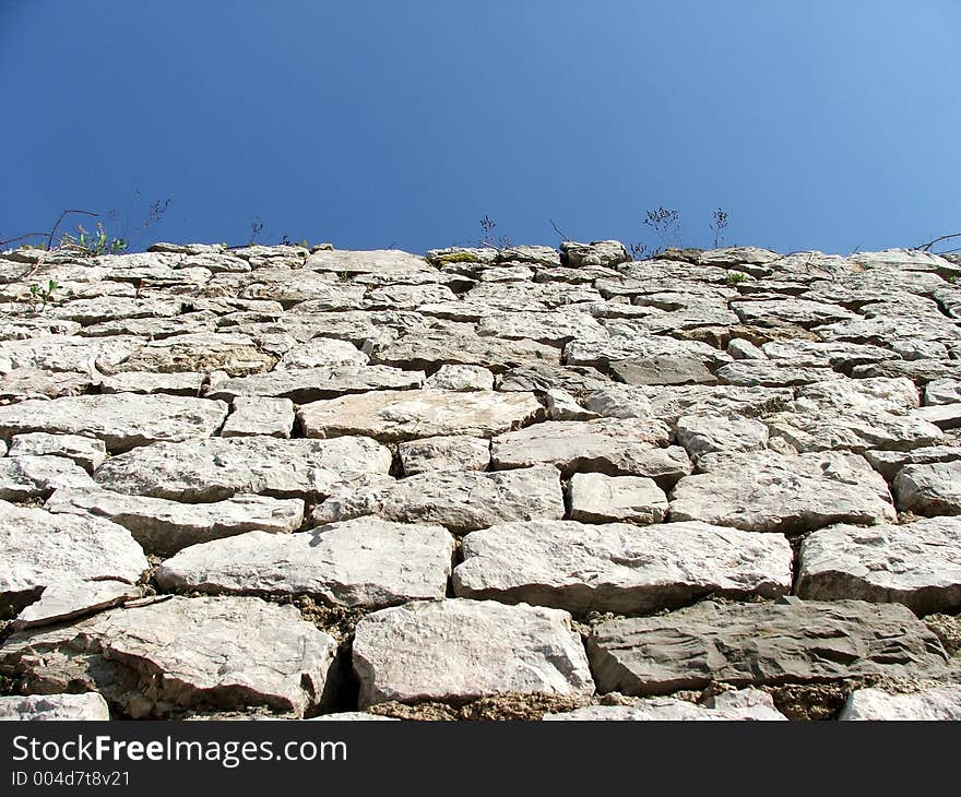 Stone wall and blue sky