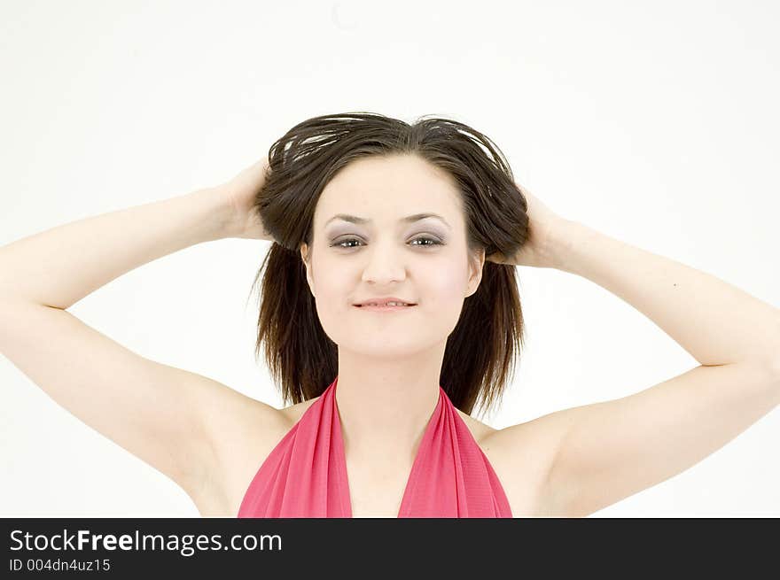 Young woman with the hands in her hair, looking free and wild. Young woman with the hands in her hair, looking free and wild