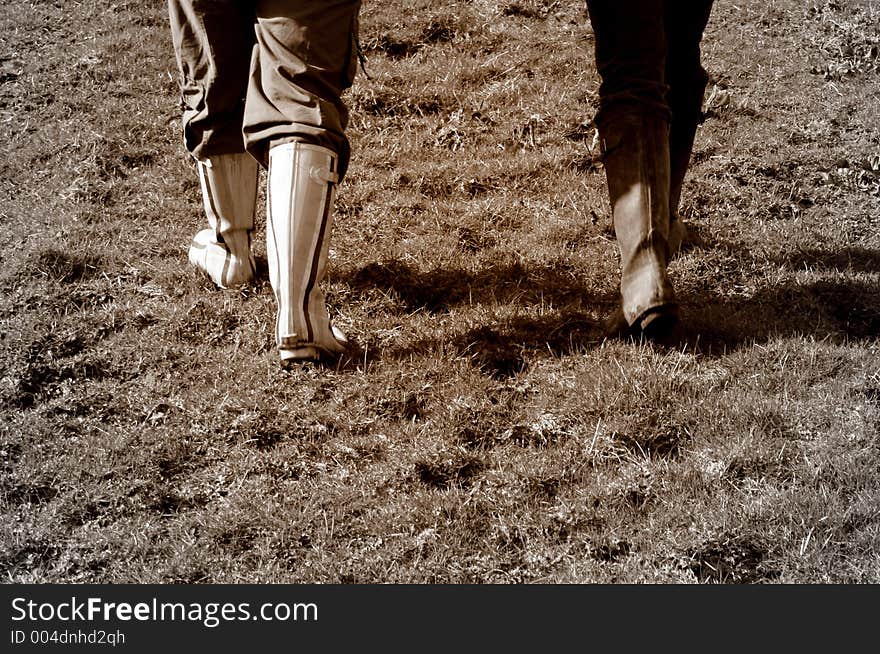 A pair of wellington boots enjoying a walk in the country. A pair of wellington boots enjoying a walk in the country