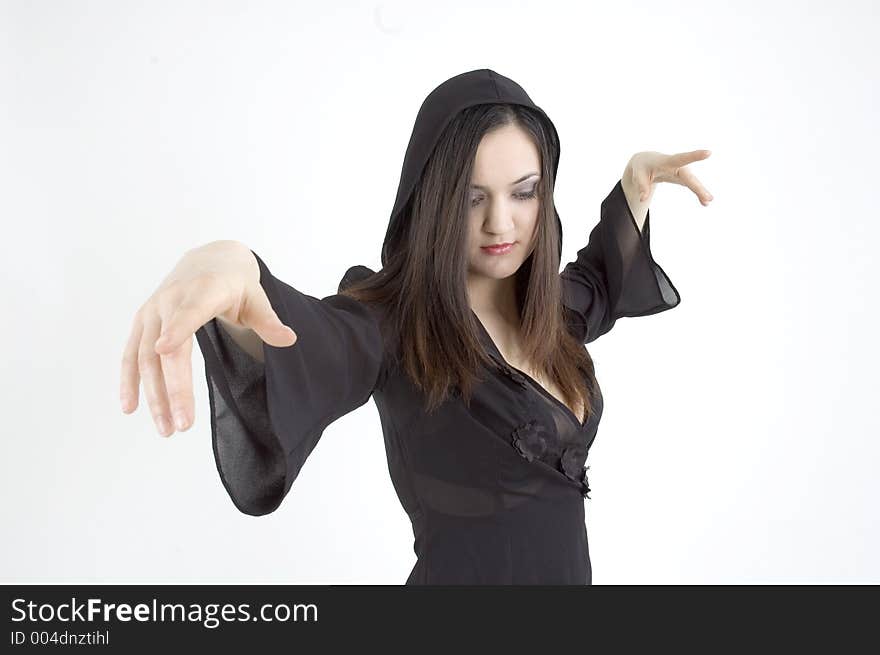 Pretty young woman listening to classical music and waving her arms as if conducting an orchestra. Pretty young woman listening to classical music and waving her arms as if conducting an orchestra.