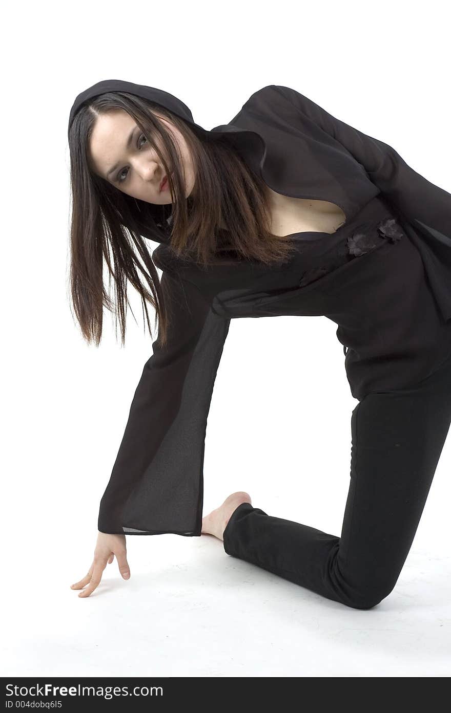 Young pretty woman performing a modern dance, wearing a black outfit. Young pretty woman performing a modern dance, wearing a black outfit.